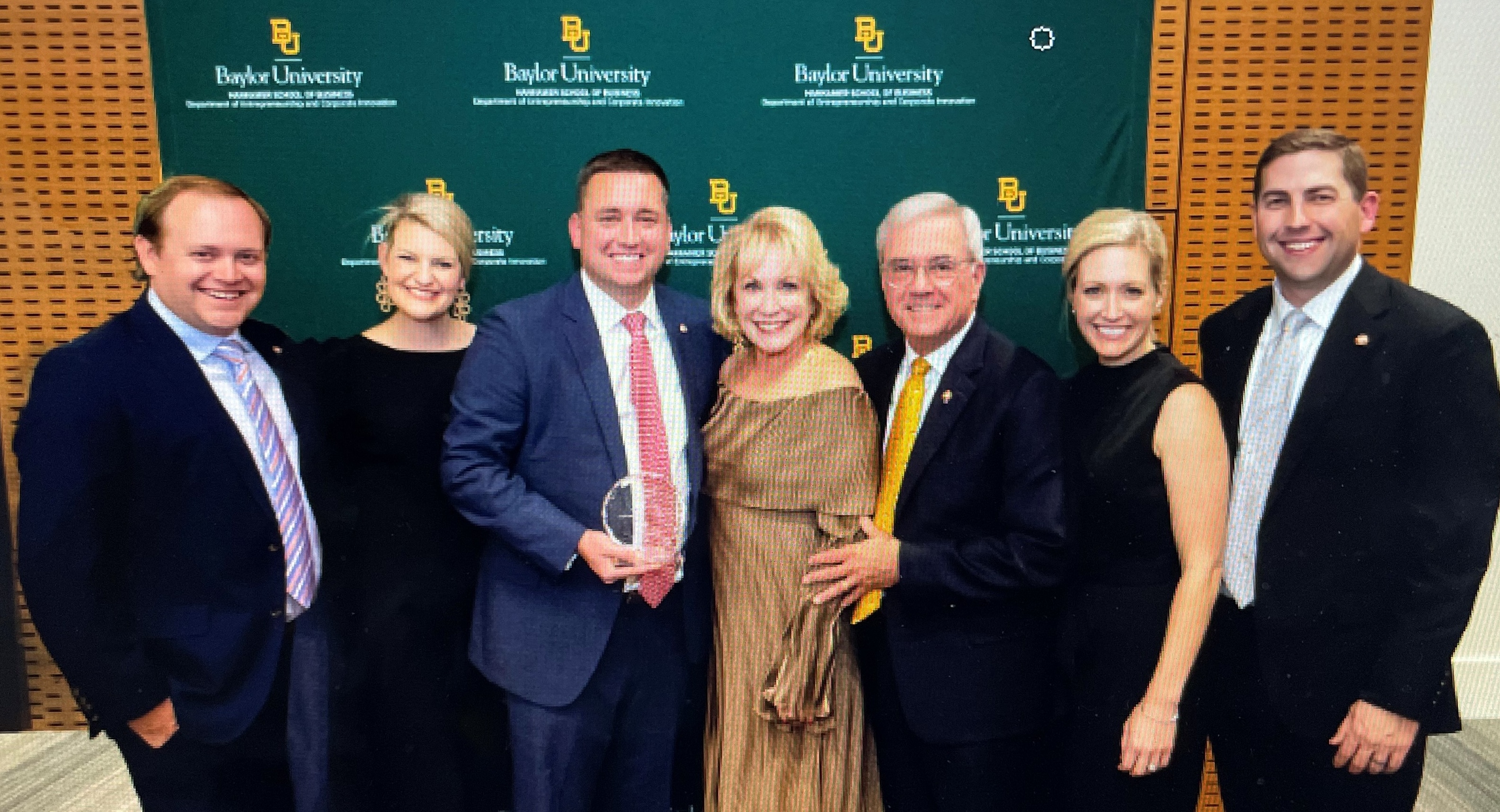 TFP Nutrition honored as family business of the year - family and company members holding award