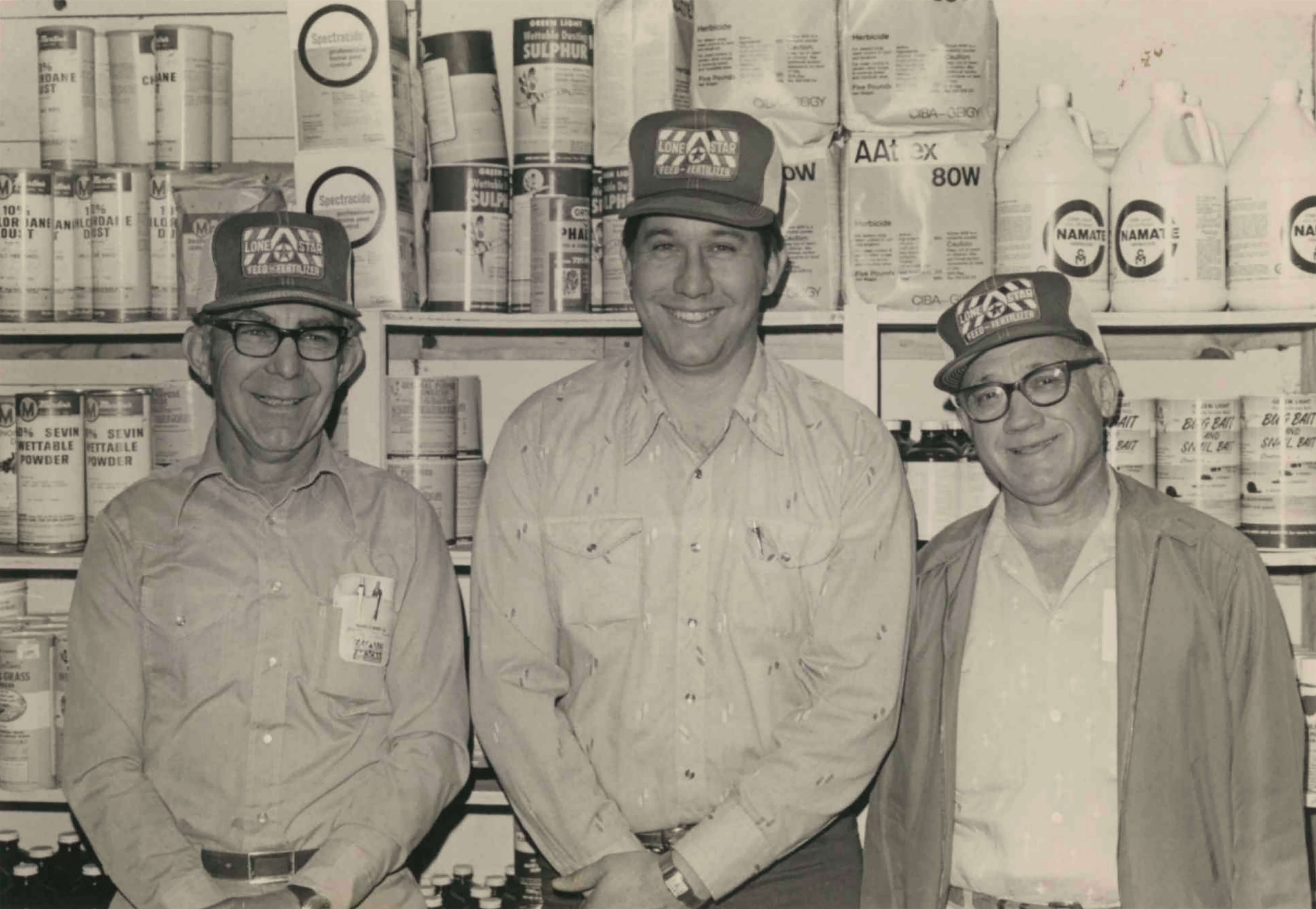 black and white photo of tfp employees having a conversation